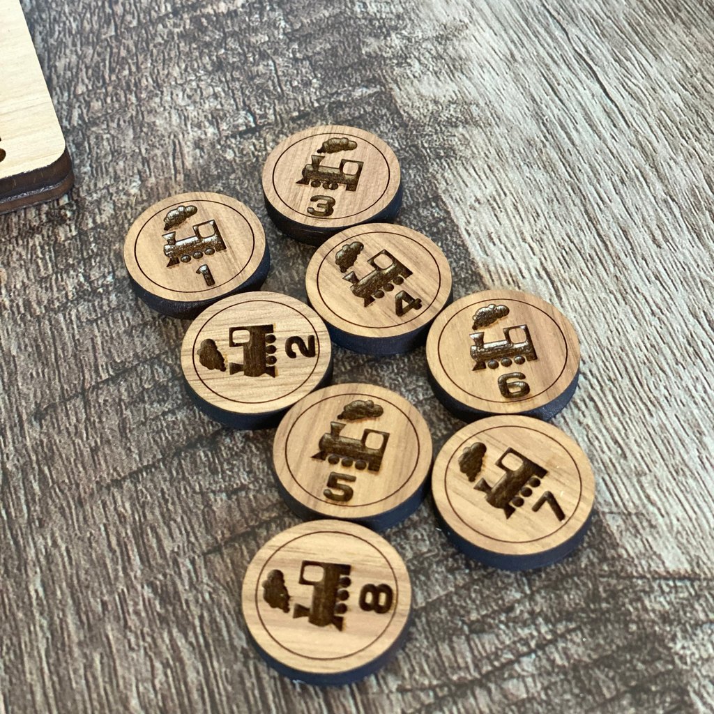 Engraved wooden train tokens
